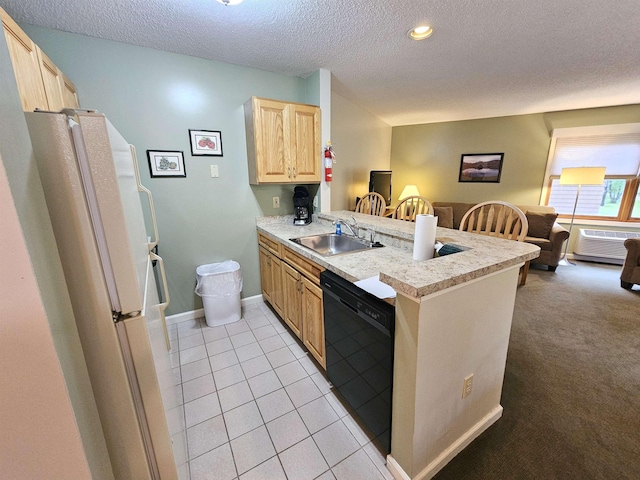 156 Deer Park Dr Unit 127D, Woodstock, NH 03262 - kitchen with dishwasher, light brown cabinets, a sink, a peninsula, and freestanding refrigerator