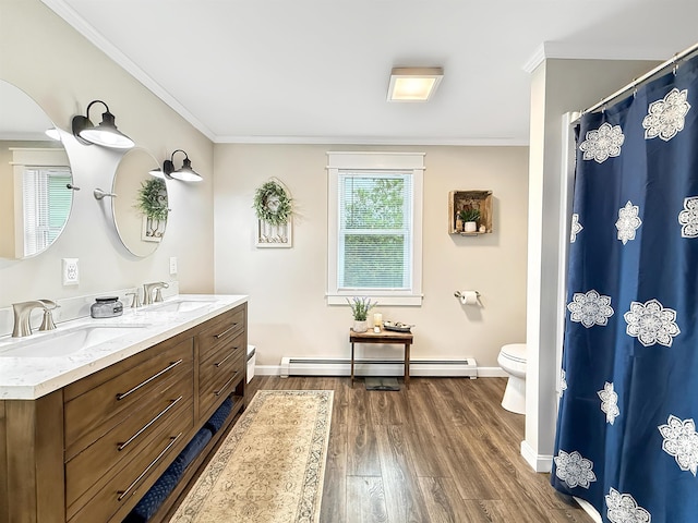 128 Gale St, Canaan, VT 05903 - full bath with toilet, baseboard heating, double vanity, ornamental molding, and baseboards