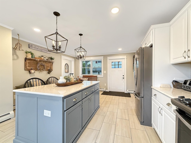 128 Gale St, Canaan, VT 05903 - kitchen featuring appliances with stainless steel finishes, white cabinetry, crown molding, a chandelier, and a kitchen island