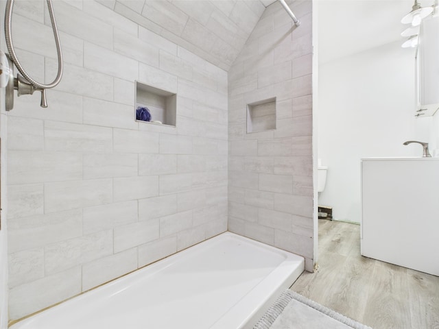 128 Gale St, Canaan, VT 05903 - bathroom featuring wood finished floors,  shower combination, and lofted ceiling