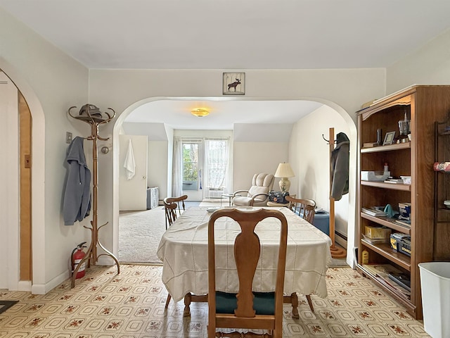 128 Gale St, Canaan, VT 05903 - dining area with arched walkways, a baseboard radiator, and baseboards