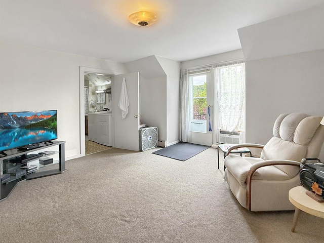 128 Gale St, Canaan, VT 05903 - living area with carpet, washer / dryer, baseboards, and a baseboard heating unit