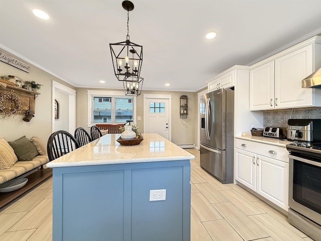 128 Gale St, Canaan, VT 05903 - kitchen with appliances with stainless steel finishes, a chandelier, white cabinetry, a center island, and hanging light fixtures