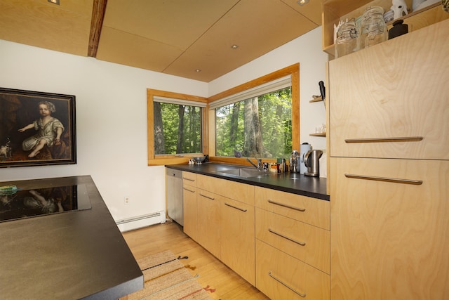 518 Shaker Blvd, Enfield, NH 03748 - kitchen with a sink, light wood-type flooring, a baseboard heating unit, and dark countertops