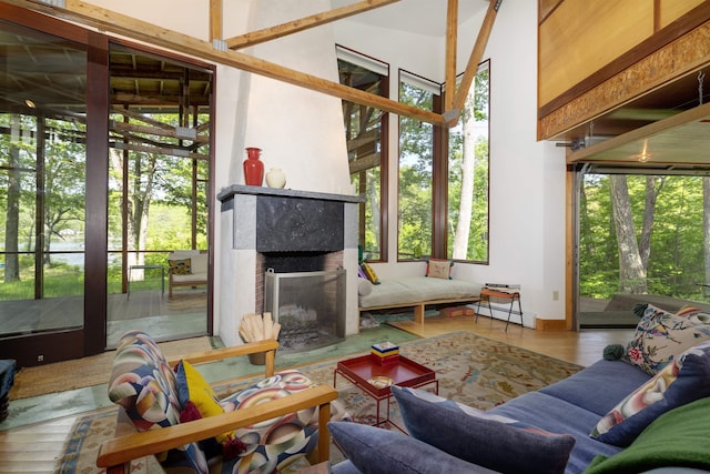 518 Shaker Blvd, Enfield, NH 03748 - living area featuring plenty of natural light, wood finished floors, and baseboard heating