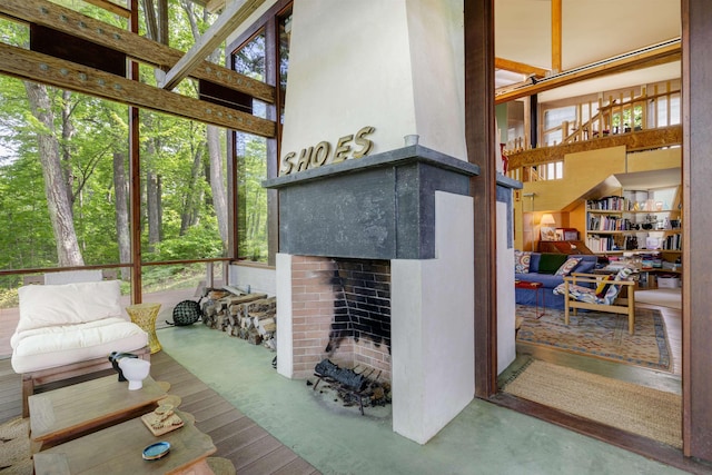 518 Shaker Blvd, Enfield, NH 03748 - living room featuring a fireplace and a high ceiling