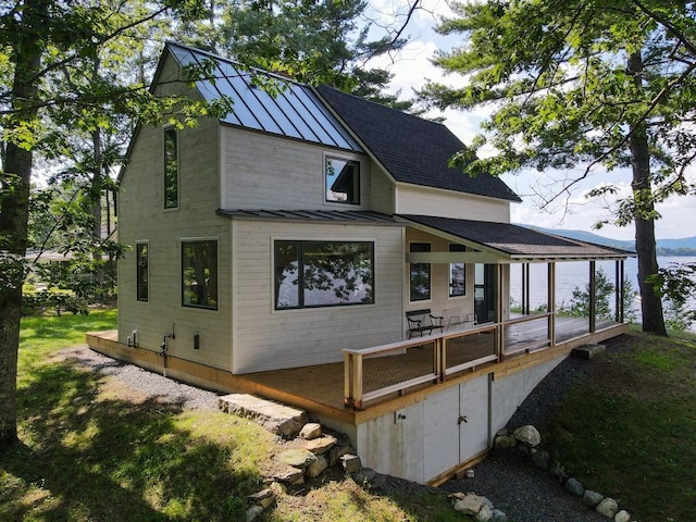 518 Shaker Blvd, Enfield, NH 03748 - back of property featuring a standing seam roof, metal roof, and a shingled roof
