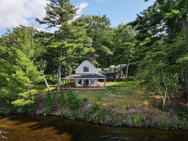 518 Shaker Blvd, Enfield, NH 03748 - rear view of property with a chimney and covered porch