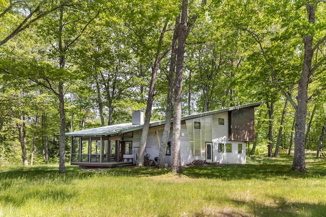 518 Shaker Blvd, Enfield, NH 03748 - view of front of house with a chimney and a front lawn