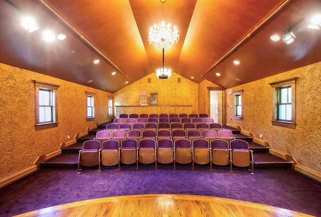 83 Maple St, Morristown, VT 05661 - carpeted cinema room with a chandelier, lofted ceiling, wood finished floors, healthy amount of natural light, and baseboards