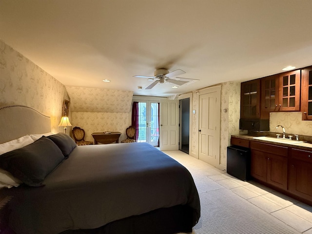 83 Maple St, Morristown, VT 05661 - bedroom featuring wallpapered walls, access to exterior, a sink, french doors, and a ceiling fan