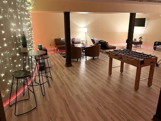83 Maple St, Morristown, VT 05661 - recreation room featuring wood finished floors and decorative columns