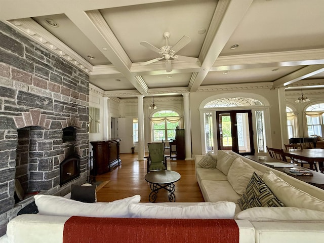 83 Maple St, Morristown, VT 05661 - living area with crown molding, ceiling fan, coffered ceiling, wood finished floors, and beamed ceiling