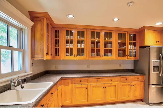 83 Maple St, Morristown, VT 05661 - kitchen featuring stainless steel fridge with ice dispenser, a sink, recessed lighting, brown cabinets, and glass insert cabinets