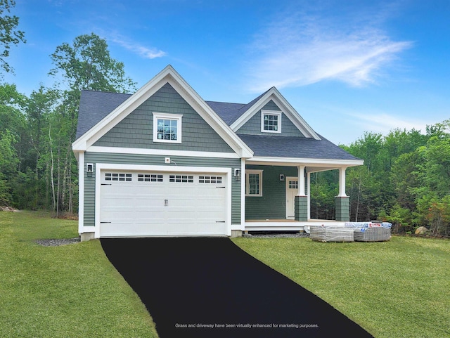 LOT47 Baker Rd Unit 47, Wells, ME 04090 - view of front of house featuring driveway, a front lawn, covered porch, and a view of trees