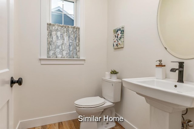 LOT47 Baker Rd Unit 47, Wells, ME 04090 - bathroom with baseboards, toilet, wood finished floors, and a sink