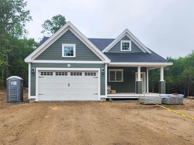 LOT47 Baker Rd Unit 47, Wells, ME 04090 - craftsman house with covered porch, dirt driveway, a garage, and roof with shingles