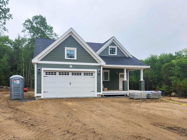 LOT47 Baker Rd Unit 47, Wells, ME 04090 - craftsman-style house with dirt driveway, covered porch, and a garage