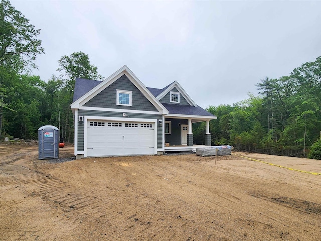 LOT47 Baker Rd Unit 47, Wells, ME 04090 - craftsman-style home with covered porch, dirt driveway, and a garage