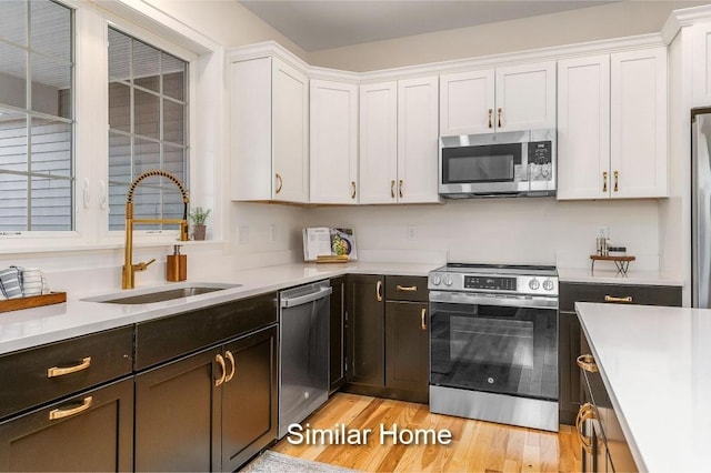 LOT47 Baker Rd Unit 47, Wells, ME 04090 - kitchen with stainless steel appliances, a sink, light countertops, and white cabinets