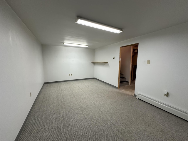 11 Pimlico Ct, Bedford, NH 03110 - carpeted empty room with a baseboard heating unit, stairway, and baseboards