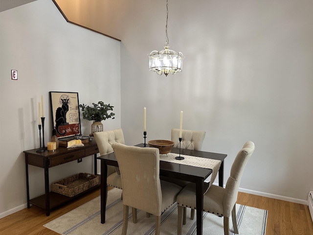 11 Pimlico Ct, Bedford, NH 03110 - dining space with light wood-style flooring, baseboards, a chandelier, and baseboard heating