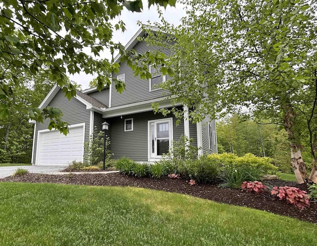 76 Cottonwood Way, Manchester, NH 03102 - view of front facade with a front yard, concrete driveway, and a garage