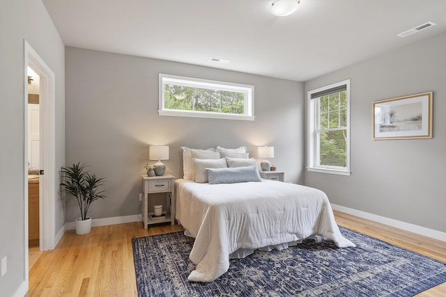 76 Cottonwood Way, Manchester, NH 03102 - bedroom with light wood finished floors and baseboards