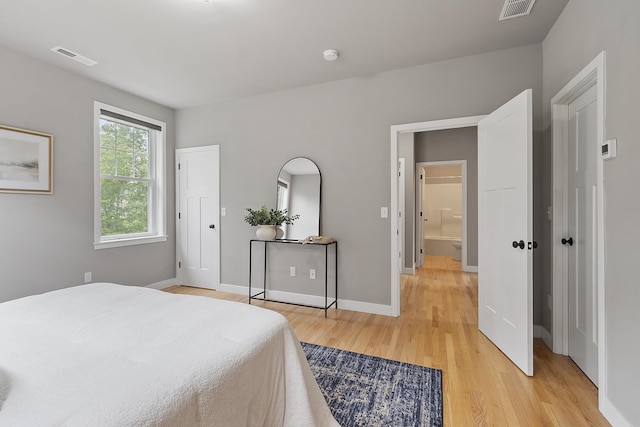 76 Cottonwood Way, Manchester, NH 03102 - bedroom featuring light wood-type flooring and baseboards