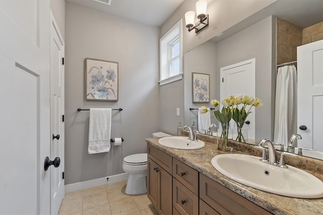 76 Cottonwood Way, Manchester, NH 03102 - full bath with double vanity, toilet, baseboards, tile patterned flooring, and curtained shower