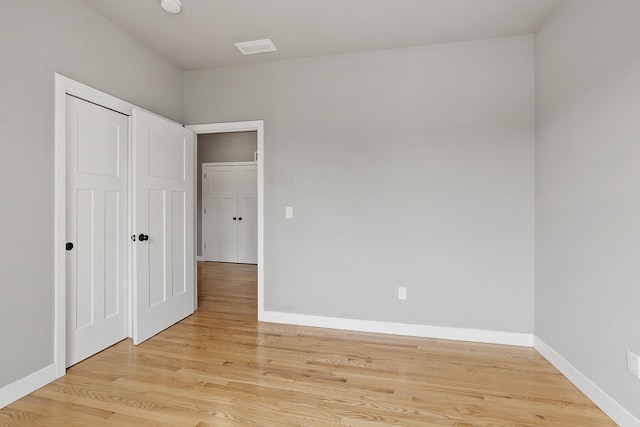 76 Cottonwood Way, Manchester, NH 03102 - unfurnished bedroom featuring light wood-type flooring and baseboards