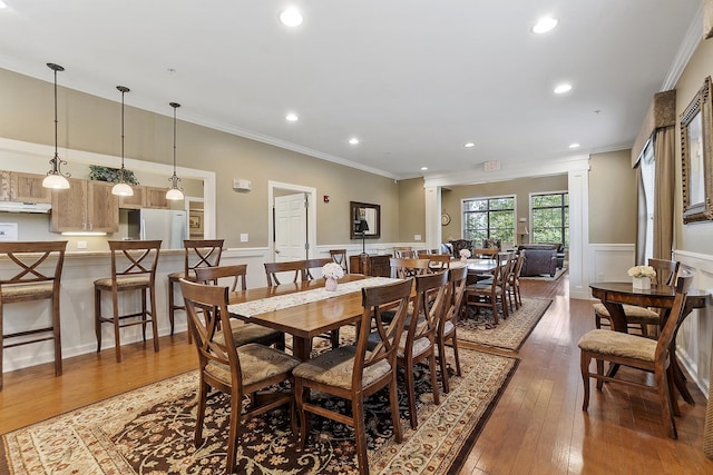 76 Cottonwood Way, Manchester, NH 03102 - dining room with crown molding, wainscoting, wood-type flooring, recessed lighting, and decorative columns