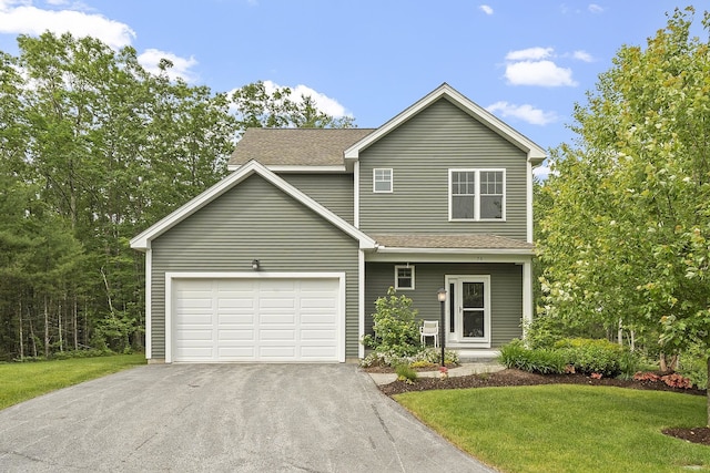 76 Cottonwood Way, Manchester, NH 03102 - traditional-style home with driveway, an attached garage, and a front lawn