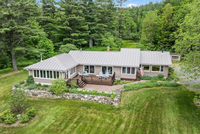 372 Brill Rd, Landaff, NH 03785 - back of house featuring a wooden deck, metal roof, a view of trees, and a yard
