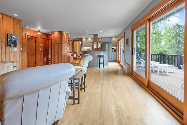 372 Brill Rd, Landaff, NH 03785 - kitchen featuring freestanding refrigerator, island range hood, a breakfast bar, light wood-style floors, and recessed lighting