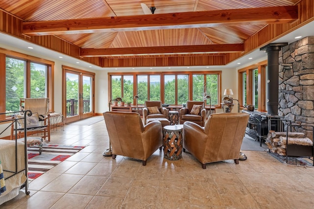 372 Brill Rd, Landaff, NH 03785 - living room featuring wood ceiling, a wood stove, healthy amount of natural light, light tile patterned floors, and french doors