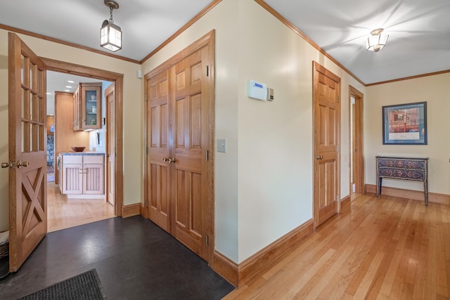 372 Brill Rd, Landaff, NH 03785 - foyer entrance featuring baseboards, ornamental molding, and light wood finished floors