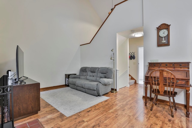 47 Trailside Ln Unit 18, Francestown, NH 03043 - living room featuring vaulted ceiling, wood finished floors, and stairway