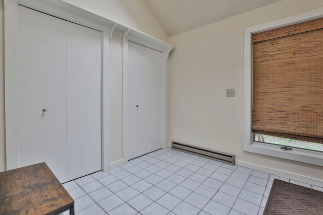 47 Trailside Ln Unit 18, Francestown, NH 03043 - interior space with baseboard heating, light tile patterned flooring, vaulted ceiling, and a closet