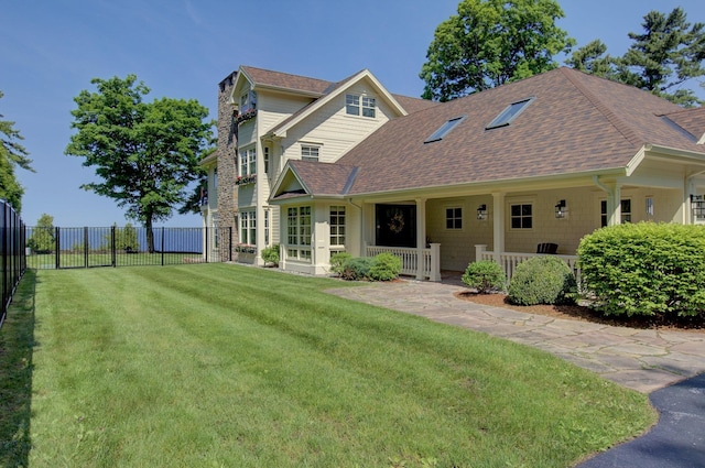 194 Maquam Shore Rd, Swanton, VT 05488 - back of house with a shingled roof and a chimney