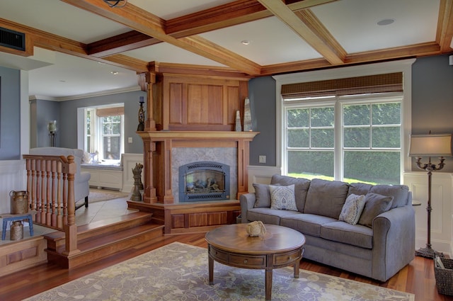 194 Maquam Shore Rd, Swanton, VT 05488 - living room featuring light wood-type flooring, a fireplace, wainscoting, beamed ceiling, and coffered ceiling