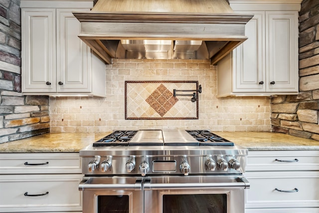 32 Burnham Rd, Windham, NH 03087 - kitchen with stainless steel range, backsplash, range hood, light stone counters, and white cabinetry