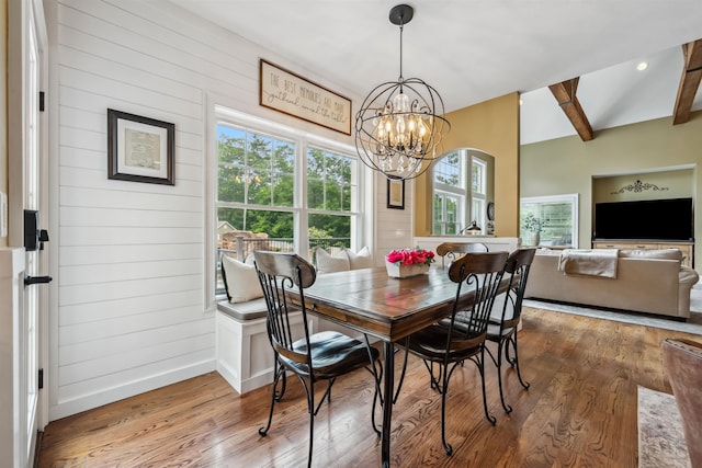 32 Burnham Rd, Windham, NH 03087 - dining room with wood finished floors, a chandelier, beamed ceiling, and wood walls