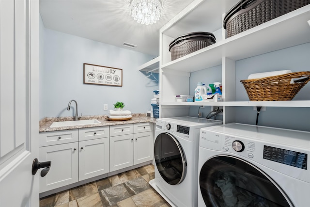 32 Burnham Rd, Windham, NH 03087 - laundry room featuring separate washer and dryer, stone finish flooring, cabinet space, and a chandelier