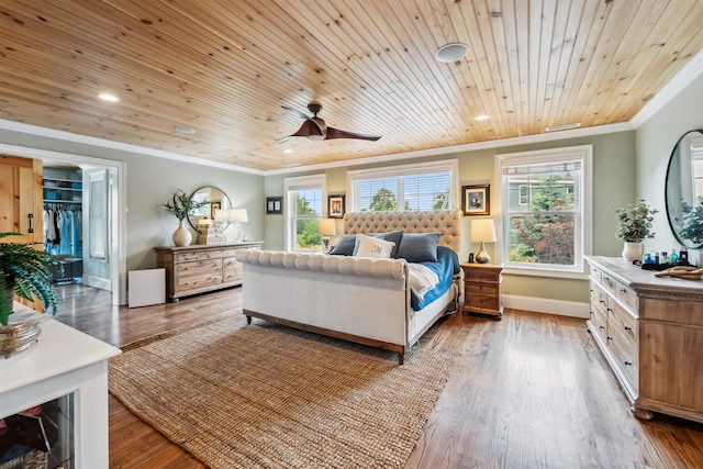 32 Burnham Rd, Windham, NH 03087 - bedroom with ornamental molding, multiple windows, recessed lighting, wood finished floors, and a spacious closet