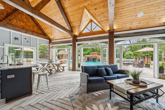 32 Burnham Rd, Windham, NH 03087 - sunroom with plenty of natural light and a chandelier