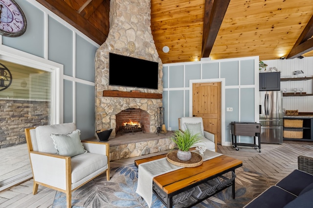 32 Burnham Rd, Windham, NH 03087 - living area featuring a fireplace and wood ceiling