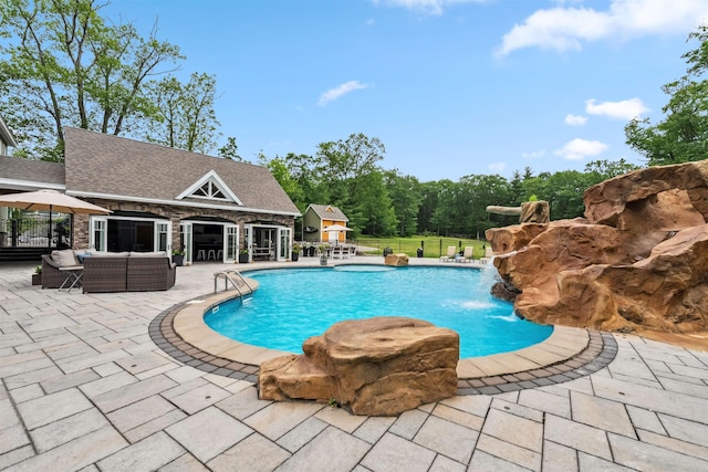 32 Burnham Rd, Windham, NH 03087 - view of swimming pool featuring a patio, an outdoor structure, and an outdoor living space