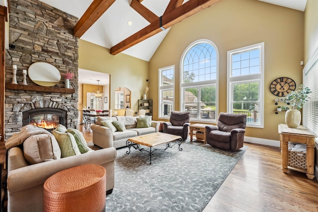 32 Burnham Rd, Windham, NH 03087 - living room with high vaulted ceiling, hardwood / wood-style floors, beam ceiling, plenty of natural light, and a chandelier