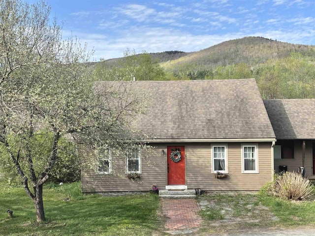 6 Alfano Dr, Enfield, NH 03748 - view of front of house featuring a mountain view, a front lawn, and roof with shingles